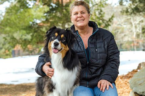Rocky Lage, an Australian shepherd and their owner